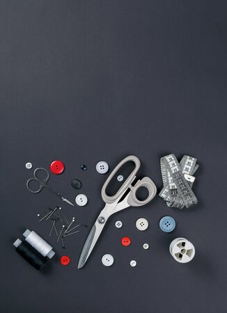 sewing items on a black background from aboveの写真素材