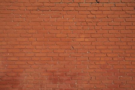 Rustic red brick wall used for house construction