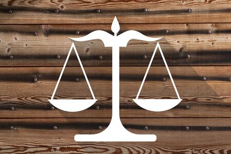 Scales of Justice icon on brick wall background