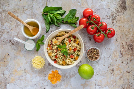 Close-up of a tabbouleh dish with surrounding ingredientsの写真素材