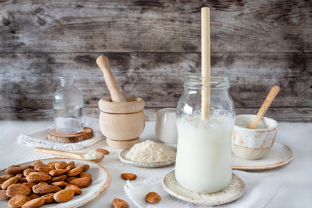 Close-up of homemade almond milk with an ecological bamboo strawの写真素材