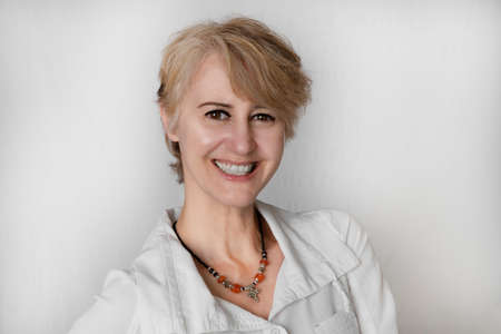 portrait of a smiling 50 year old woman in close-upの写真素材