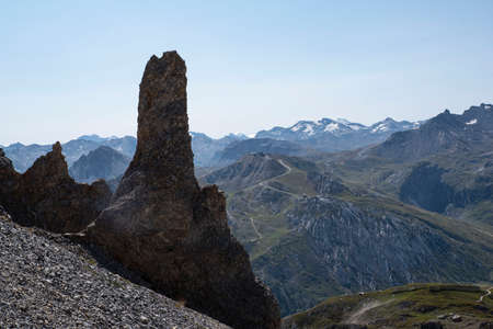Mountain landscape with a rock arch in summer in the French Alps in Tignesの写真素材