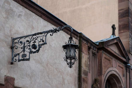 Old wrought iron street lamp with flowers and arabesquesの写真素材
