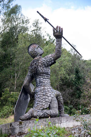 An ancient statue of a Celtic soldier in the Ardennes in Franceの写真素材