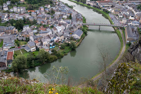 Aerial view of a town in the Ardennes crossed by the Meuse River in Franceの写真素材