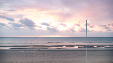 Sunset on a beach by the seaの写真素材