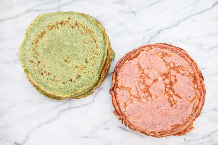 Close-up of pink beetroot pancakes and green spinach pancakesの写真素材