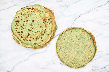 Close-up of green pancakes with spinachの写真素材