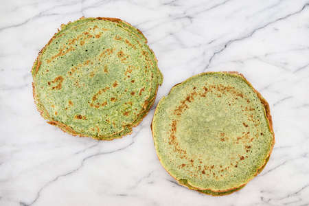 Close-up of green pancakes with spinachの写真素材