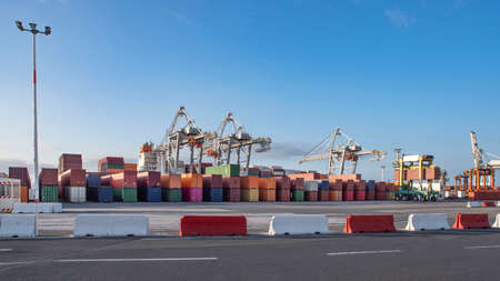Unloading of containers from a ship on the quay of the port of Le Havreの写真素材