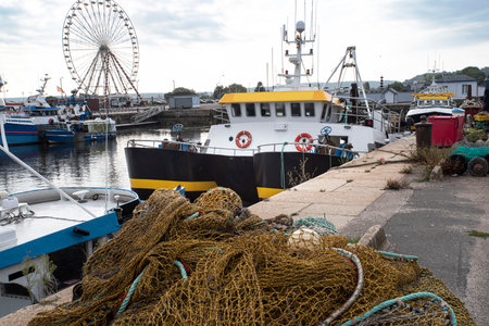A fishing boat with its nets in a port in Normandy, Franceの写真素材