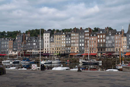 City of Honfleur in Normandy with its typical houses and boat lock in the quayの写真素材