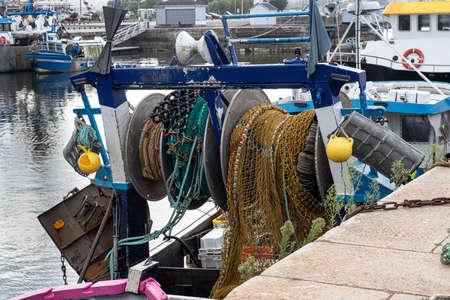 A fishing boat with its nets in a port in Normandy, Franceの写真素材