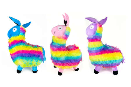 Three colorful llama plushies in rainbow colorsの写真素材