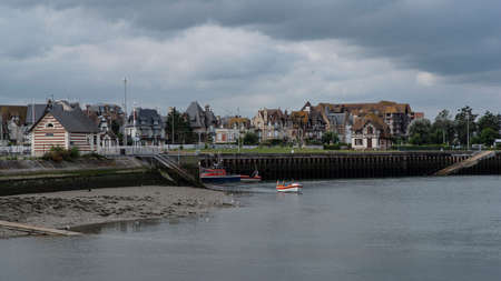 Typical Normandy house and boats in the port of Trouville in Normandy, Franceの写真素材