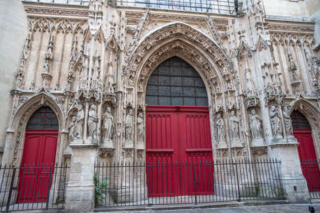 Detail of the red wooden portal of a church in Paris, Franceの写真素材