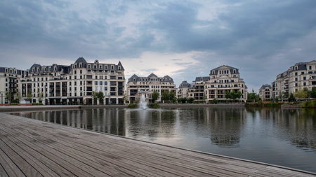 Modern architecture of apartment buildings in a residential area on a lakeの写真素材