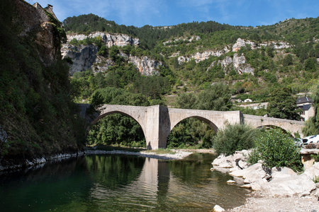 Picturesque village in the Gorges du Tarn in France with a typical bridgeの写真素材