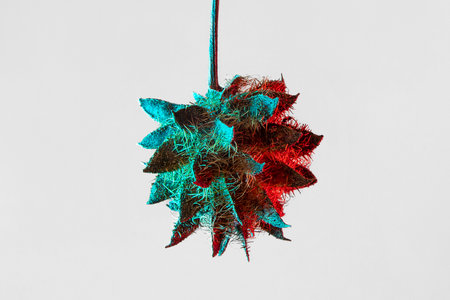 Cyberpunk style glycyrrhiza glabra seed with two-tone lighting on a light gray backgroundの写真素材