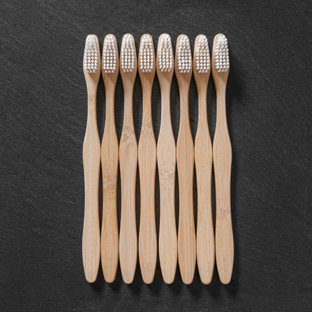 Close-up of toothbrushes on a black slate backgroundの写真素材
