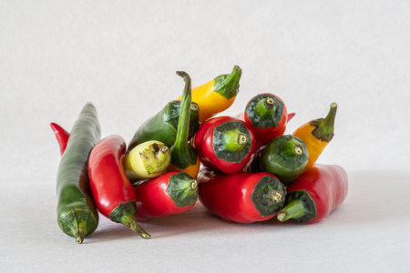 Close-up of different colored chilliesの写真素材