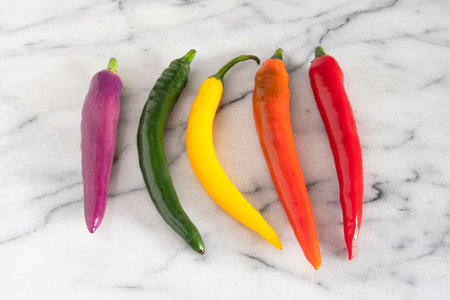 Close-up of different colored chilliesの写真素材