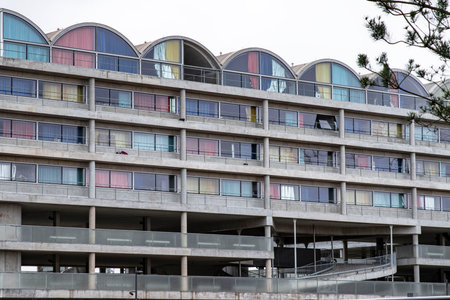 Apartment building with colored curtainsの写真素材