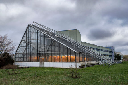 Architecture of a yellow-lit greenhouse for ecological agricultureの写真素材