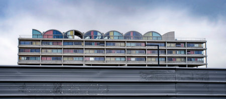 Apartment building with colored curtainsの写真素材