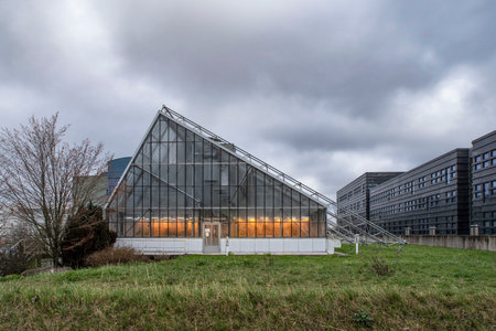 Architecture of a yellow-lit greenhouse for ecological agricultureの写真素材