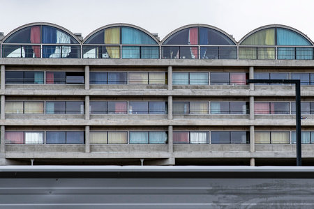 Apartment building with colored curtainsの写真素材