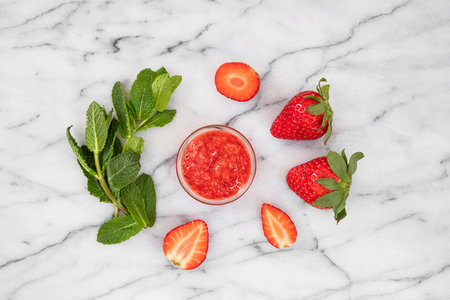 Close-up of strawberries and homemade jam with fresh mintの写真素材