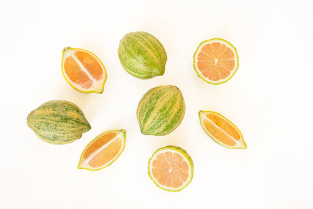 Close-up of pink lemons with stripes on a white backgroundの写真素材