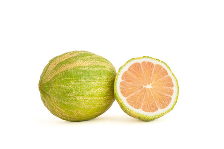 Close-up of pink lemons with stripes on a white backgroundの写真素材