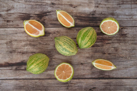 Close-up of pink lemons with stripes on a wooden backgroundの写真素材