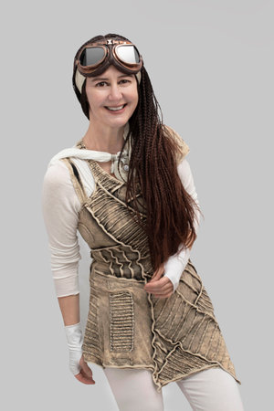 A 50 year old woman with an original style, a little futuristic or steampunk with a beautiful smileの写真素材