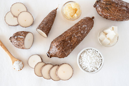 Cassava root on white background with tapioca pearlsの写真素材