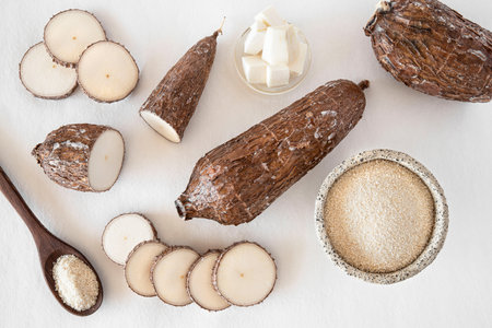 Cassava root and flour on a white backgroundの写真素材