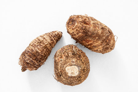 whole raw taro or eddo tuber rootの写真素材