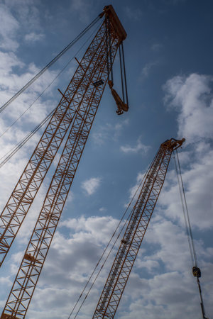 Giant crane on an urban construction siteの写真素材