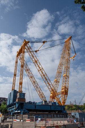 Giant crane on an urban construction siteの写真素材