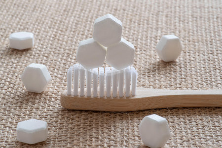 White solid toothpaste tablet with bamboo toothbrushの写真素材