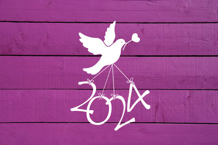 A dove flying the numbers of the new year 2024の写真素材
