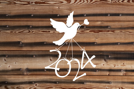 A dove flying the numbers of the new year 2024の写真素材