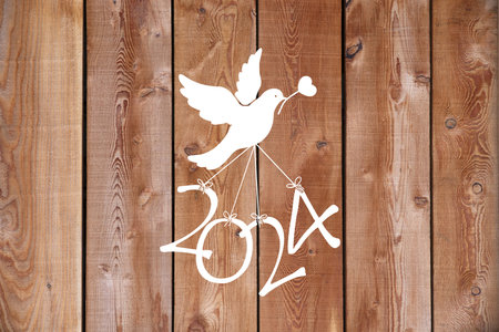 A dove flying the numbers of the new year 2024の写真素材
