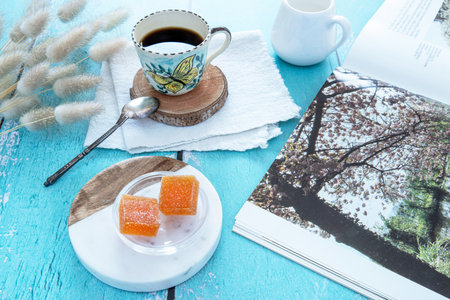 Fruit paste, coffee and reading for a relaxing break in natureの写真素材