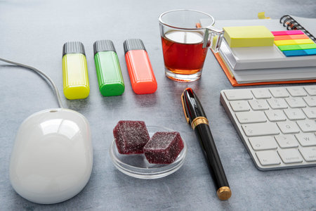Office coffee breaks with fruit pastes, notepads and post-itsの写真素材