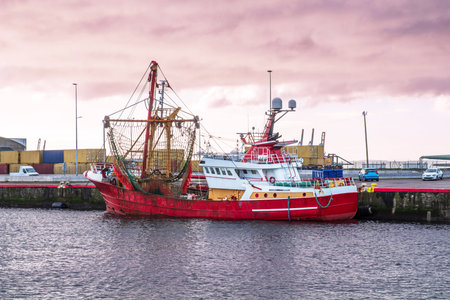 A fishing boat moored on the quayside in the port of Le Havre in Franceの写真素材