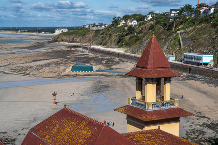 Landscape of the town of Granville in Normandy in France, with the beach, the coast, the sea and typical old housesの写真素材